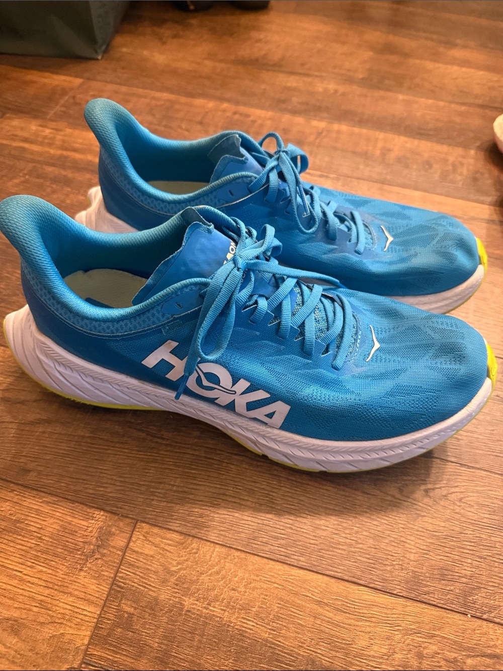 Hoka men’s One One Carbon X2 running shoes in a blue and citrus colorway